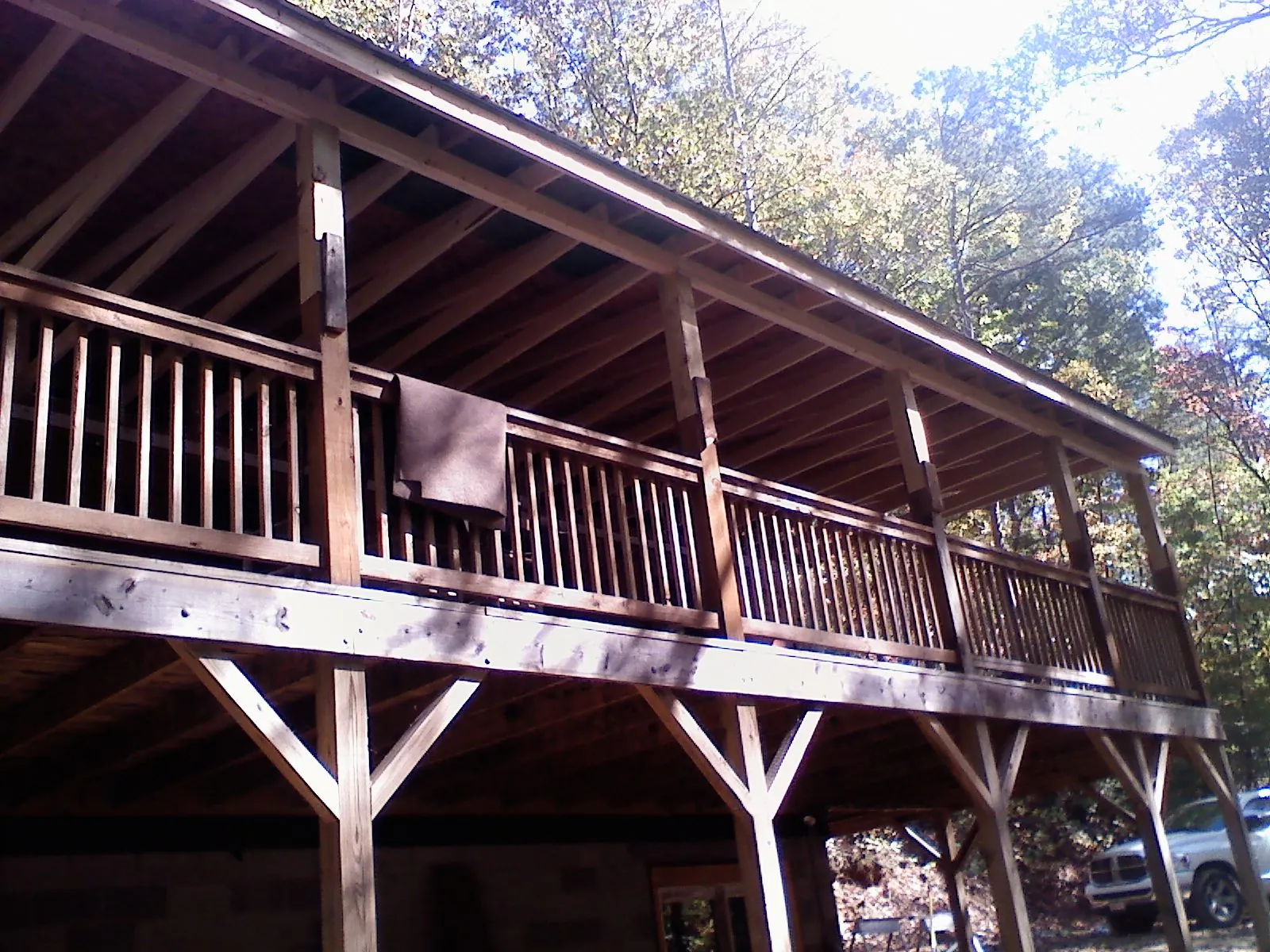 Timber framing under a new elevated porch and deck — Roof Leak Repair in Goffstown by Roofing Brothers